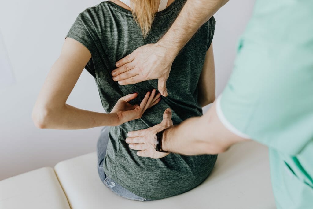 Photo by Karolina Grabowska: https://www.pexels.com/photo/doctor-examines-woman-s-back-4506109/